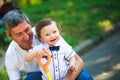 Little beautiful boy in the arms of his father. Royalty Free Stock Photo