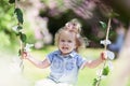 Little beautiful cheerful girl walking in a summer park Royalty Free Stock Photo