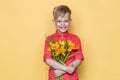 Little beautiful child with pink shirt gives a bouquet of flowers on Women`s Day, Mother`s Day. Birthday. Valentine`s day. Spring. Royalty Free Stock Photo