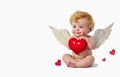 Little beautiful cute baby cupid holding a red heart on a white background Royalty Free Stock Photo
