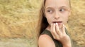 Little beautiful girl with blond hair and manicure