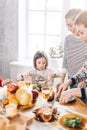 Little beautiful girl degustating meat during the holiday Royalty Free Stock Photo