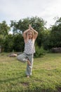 Little beautiful girl doing yoga in the park Royalty Free Stock Photo