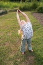 Little beautiful girl doing yoga in the park Royalty Free Stock Photo