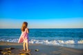 girl in dress walking on the beach Royalty Free Stock Photo