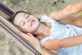 Little beautiful girl lies in a hammock Royalty Free Stock Photo
