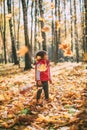 beautiful girl loves autumn, walks in autumn forest and smiles
