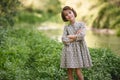 Little girl in nature stream wearing beautiful dress Royalty Free Stock Photo