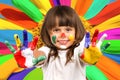 Little beautiful girl and paint Royalty Free Stock Photo