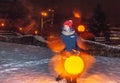 Little beautiful girl stands near the glowing ball