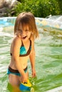 Little beautiful girl in swimming pool.