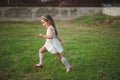 Little beautiful running girl outside