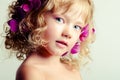 Little beauty girl with orchid flowers Royalty Free Stock Photo
