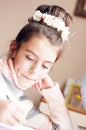 Little beautyful girl draws sitting table in room Royalty Free Stock Photo