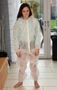 A little bit too big, girl tries protective suit Royalty Free Stock Photo