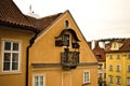 A little black bohemian balcony of a traditional house with a religious icon Prague, Czech Republic