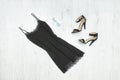 Little black dress, shoes and sunglasses. Fashionable concept Royalty Free Stock Photo