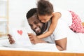 Little black girl celebrating Father`s Day with daddy