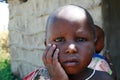 Little black girl with a dirty face, close-up portrait.