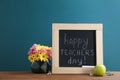 Little blackboard with inscription HAPPY TEACHER`S DAY