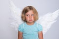 Little blond girl with angel- wings Royalty Free Stock Photo