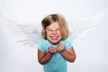 Little blond girl with angel- wings Royalty Free Stock Photo