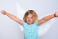 Little blond girl with angel- wings Royalty Free Stock Photo