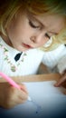 Little blond girl drawing Royalty Free Stock Photo