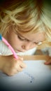 Little blond girl drawing Royalty Free Stock Photo