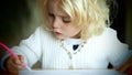 Little blond girl drawing Royalty Free Stock Photo