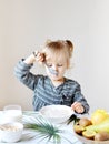 Little Blond Girl Eating Healthy Breakfast Flakes with Milk