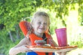 Little blond girl with handmade beach lunch