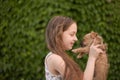 A little blond girl with her pet dog outdooors in park Royalty Free Stock Photo