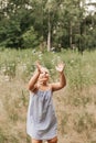 Little blond hair girl play with soap bubbles  in park, family activity during summer. Feeling happiness, joyful, cheerful and Royalty Free Stock Photo