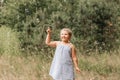 Little blond hair girl play with soap bubbles  in park, family activity during summer. Feeling happiness, joyful, cheerful and Royalty Free Stock Photo