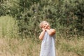 Little blond hair girl play with soap bubbles  in park, family activity during summer. Feeling happiness, joyful, cheerful and Royalty Free Stock Photo