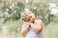 Little blond hair girl play with soap bubbles  in park, family activity during summer. Feeling happiness, joyful, cheerful and Royalty Free Stock Photo