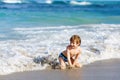 Little blond kid boy having fun on ocean beach in Florida Royalty Free Stock Photo