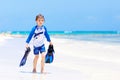 Little blond kid boy having fun on tropical beach of Bora Bora Royalty Free Stock Photo