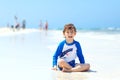 Little blond kid boy having fun on tropical beach of Jamaica Royalty Free Stock Photo