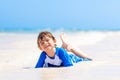 Little blond kid boy having fun on tropical beach of Jamaica Royalty Free Stock Photo