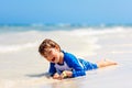 Little blond kid boy having fun on tropical beach of Maldives Royalty Free Stock Photo