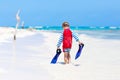 Little blond kid boy having fun on tropical beach of Maldives Royalty Free Stock Photo