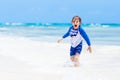 Little blond kid boy having fun on tropical beach of Maldives Royalty Free Stock Photo