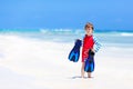 Little blond kid boy having fun on tropical beach of Maldives Royalty Free Stock Photo