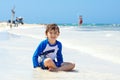 Little blond kid boy having fun on tropical beach of Mexiko Royalty Free Stock Photo