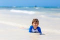 Little blond kid boy having fun on tropical beach of Seychelles Royalty Free Stock Photo