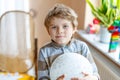 Little blond preschool kid boy with air balloon ball Royalty Free Stock Photo