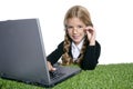 Little blond school girl with laptop Royalty Free Stock Photo