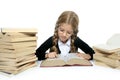 Little blond student school girl reading old book Royalty Free Stock Photo